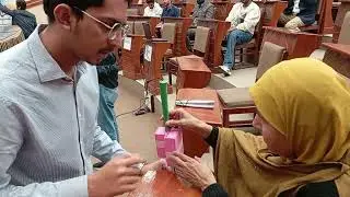 Ms Shakila Yasmin experiencing NED's students' Assistive Device for Blind 