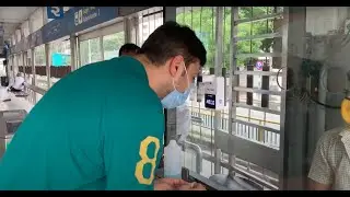 Fevobot Automatic Wall-mounted Thermometer installed at public transit | Fevo