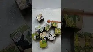 Rewind video of a wooden block toy with a panda image