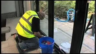 18 mtr Bifolding door being installed by our installation team contact Express 0800 121 4809