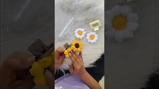 Bold sunflower crochet hair claw or the soft, delicate daisy crochet claw clip?