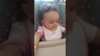 Morning baby dances while eating breakfast. Happy dance.