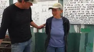 Building Community Brick Project: Josh Explains to Volunteer Staff How the Art Project Works