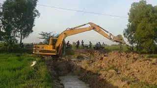 Excavator CAT is Digging the Mud to Make Canal in Rice Field at Country Side #KhmerAgriculture