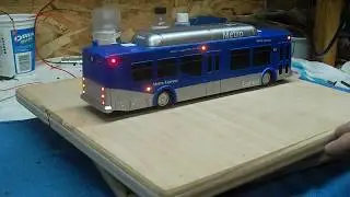 Lighted Blue Nabi low floor lighted California Metro Express Bus