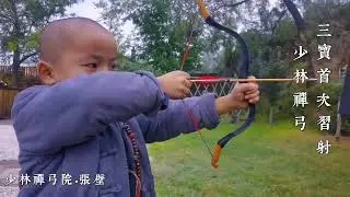 Teaching Little Shaolin Monk how to do Archery 教小和尚射箭