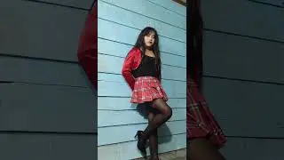 Crossdresser in mini pleated skirt