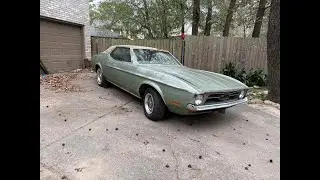 1973 Mustang Grande sitting in a field