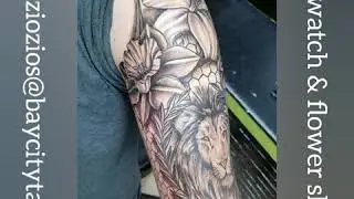 Flowers, lion and pocket watch sleeve tattoo
