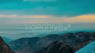 Clouds Float In Bottom Of The Mountains At Sunset by Timelapse4K   Hive