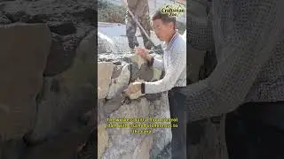 The workers built a flood control dam with crushed stones next to the canal