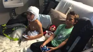 Ricky helping Grey pass the time with games.