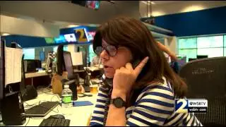 RAW: Watch this news producer calmly talk to a man with a bomb holding hostages