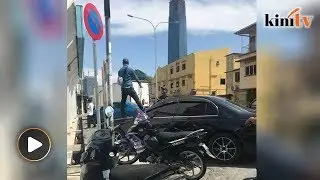 Man parks in front of 'no parking' sign, yells at DBKL personnel