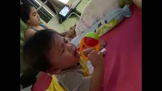 Sevi while playing his rattle toy
