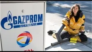 Greenpeace activists chain themselves to fuel pumps