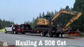 Stole a load from a SEMI!   Ram 5500 Cummins hauling a 308 down the mountain