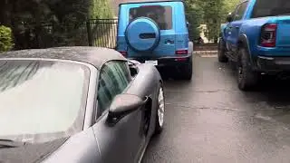 My 2025 Porsche Spyder RS is parked outside in the rain