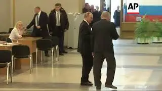 Incumbent Vladimir Putin casts vote in Russia's presidential poll