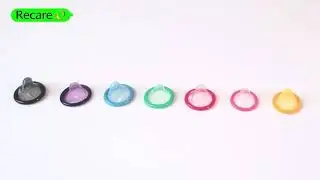 Recare colored condoms.  Colorful condoms. Red condom, yellow condom, green condom, blue condom.