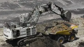 Liebherr R9350 Excavator Loading Komatsu And Caterpillar Dumpers - Coal Mining Operations