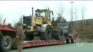 Man in front end loader destroys N S  home, flees to liquor store