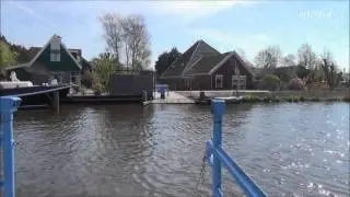 Pontje molletjesveer met molen De Woudaap .