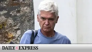 Phillip Schofield grim-faced as he breaks cover