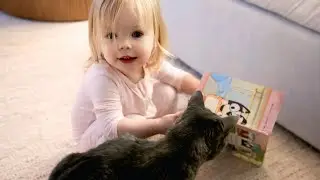ohh my sweet ellie is so funny she's Teaching Her gravy(cat) How to Read 💕🐾look at this so cute😍😍