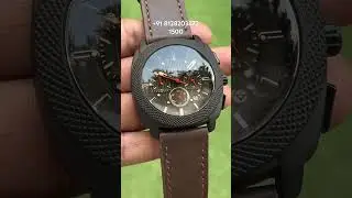 This Fossil chronograph looks bold and classy with its textured black dial, sporty orange accents