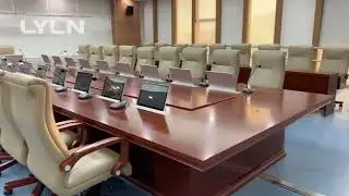 An elegant conference room, equiped with Lyln motorized monitor lifts (17.3