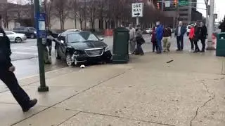 WATCH: Bystanders break window of crashed car to help driver