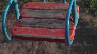 Empty swing for children slow motion