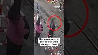 Man almost gets run over by train while staring at phone #shorts