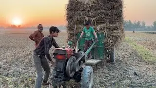 This little boy is operating the rice loading machine।এই ছোট ছেলেটি ধান বোঝাই মেশিনটি চালিয়ে নিচ্ছে।