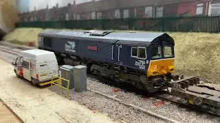66301 with a consist of wagons for tyre turning at Four Mills WRD
