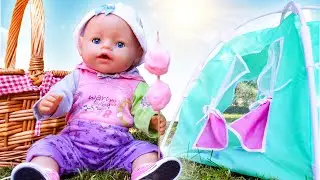 The Baby Emily doll goes on a hike and chooses doll clothes and toy food.