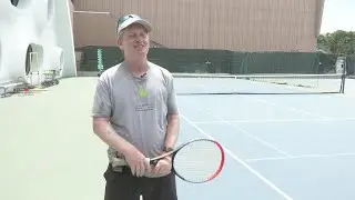 Master Pro Bruce Gullickson Gives Tennis Lesson To Norman Seawright