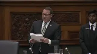 Reading a petition from the Concerned Residents Coalition