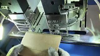 Double heads eyelet punching machine for cardboard