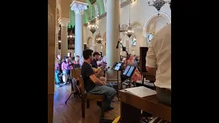 Wesley Volunteers by playing music in Church
