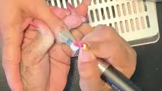 Gray nails with sticker designs and black line