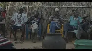 Larim tribe men drinking alcohol in during a wedding ceremony, Boya Mountains, Imatong, South Sudan
