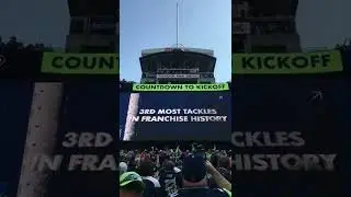 KJ Wright raises 12 Flag.
