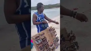 5-year-old Leo negotiates hard with beach peddler in Sardinia