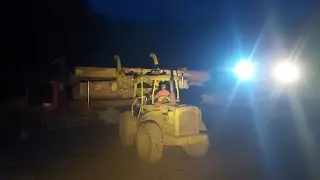 TIMBER TRUCK , unloading logs