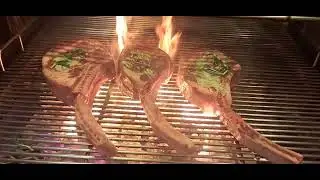 charcoal grill tomahawk steak on fire #