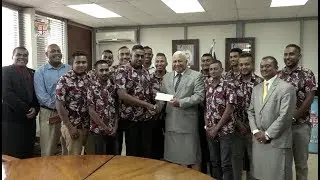 Fijian Prime Minister receives a cheque donation from Xplizit Car Club of Fiji