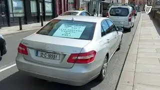 Taxi drivers make their way towards government buildings as part of protest
