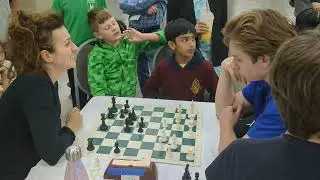 playing against grandmaster Irina Crush in chess